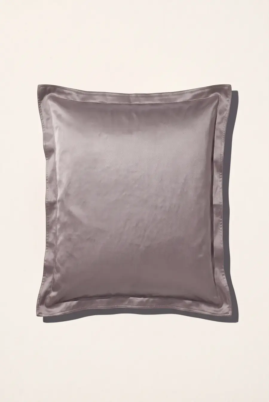 Taupe silk pillowcase on a white background